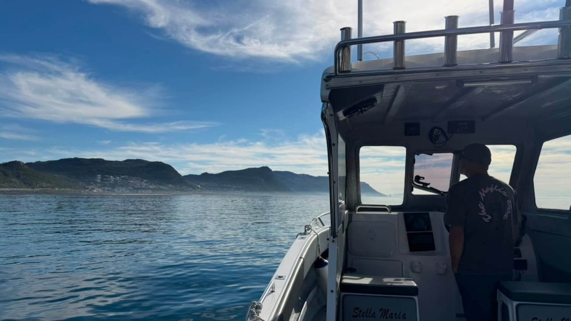 Rods rigged aboard the Stella Maria with the False Bay coastline ahead