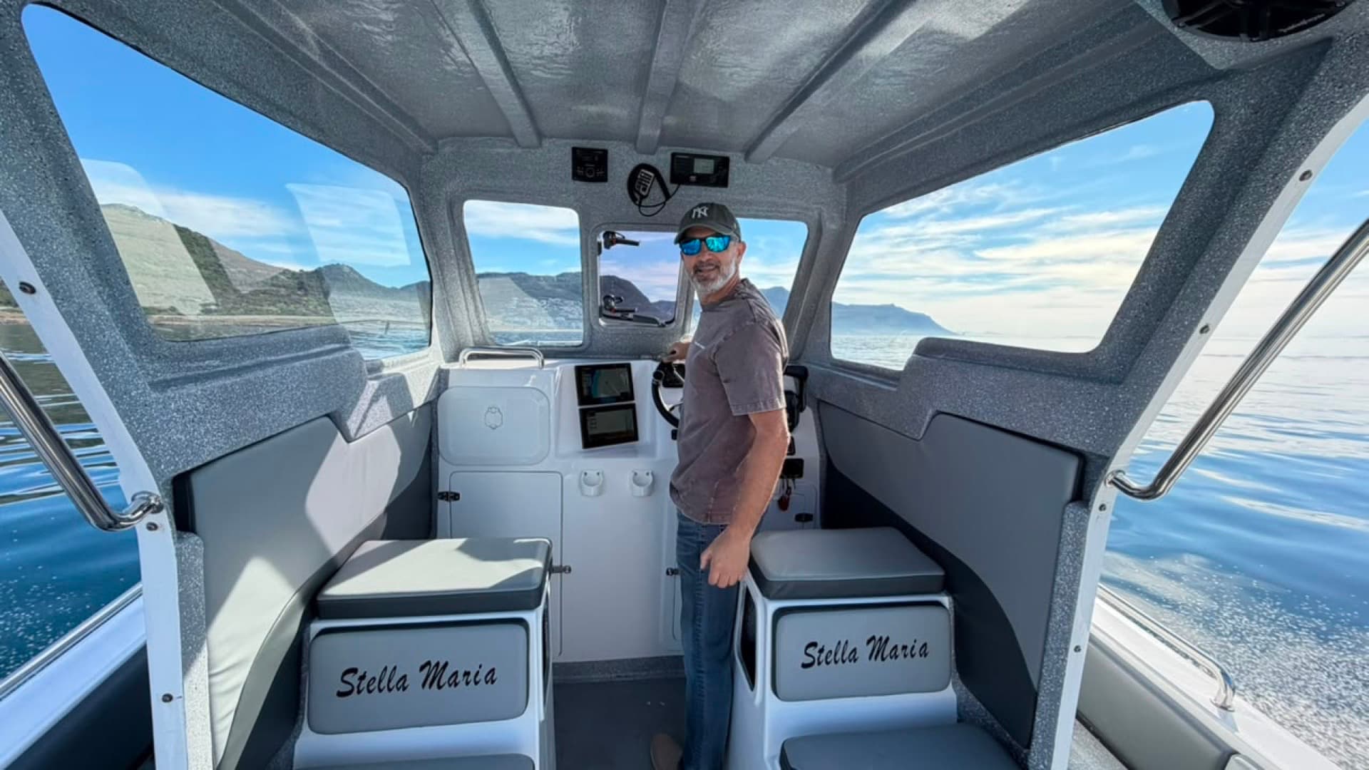 Captain Anees at the helm of the Stella Maria